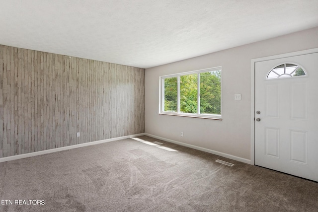 view of carpeted entrance foyer