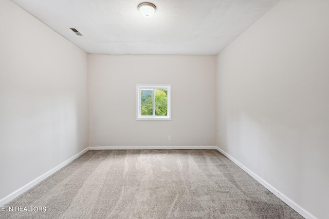 unfurnished room featuring carpet flooring