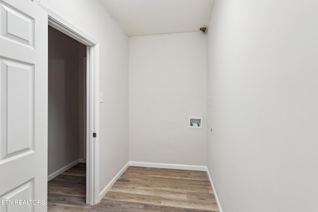 laundry area with hardwood / wood-style flooring and washer hookup