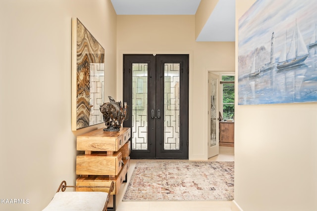 tiled foyer entrance featuring french doors