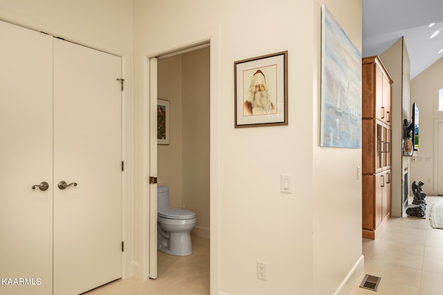 hallway with light tile floors