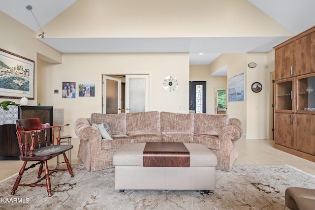 tiled living room with high vaulted ceiling