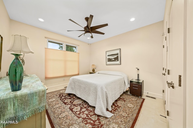 tiled bedroom featuring ceiling fan