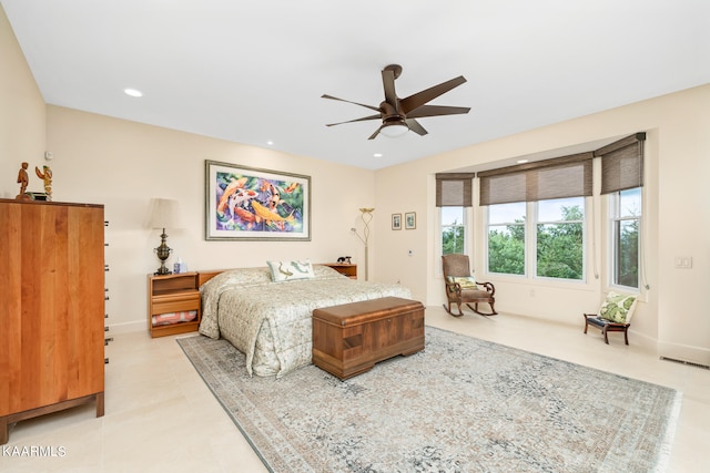 tiled bedroom with ceiling fan