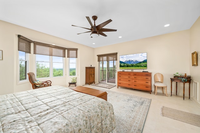 bedroom with ceiling fan, multiple windows, and access to outside