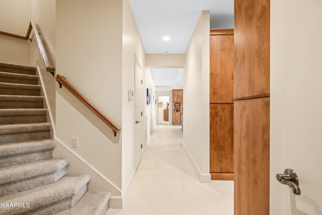 hallway featuring light tile floors