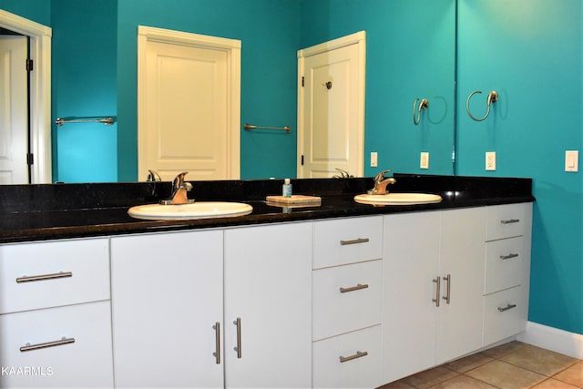 bathroom featuring tile flooring and dual bowl vanity