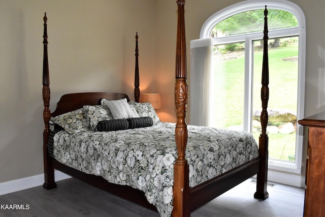 bedroom featuring dark wood-type flooring