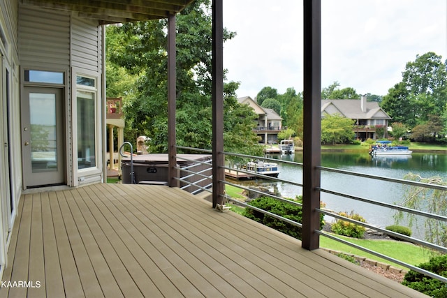 wooden deck with a water view