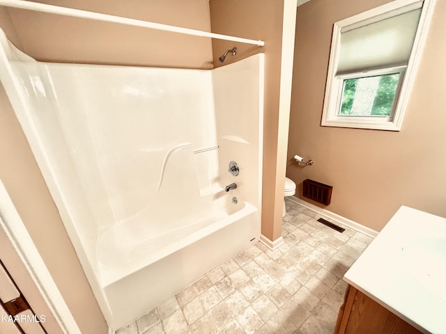 full bathroom featuring vanity, tile flooring, toilet, and bathing tub / shower combination