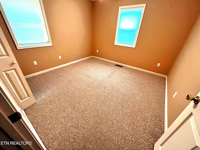 empty room with carpet flooring