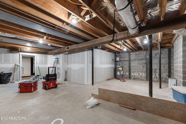 basement featuring electric water heater