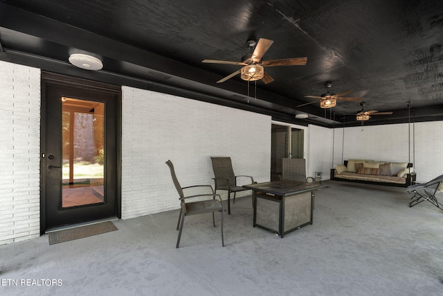 exterior space featuring ceiling fan