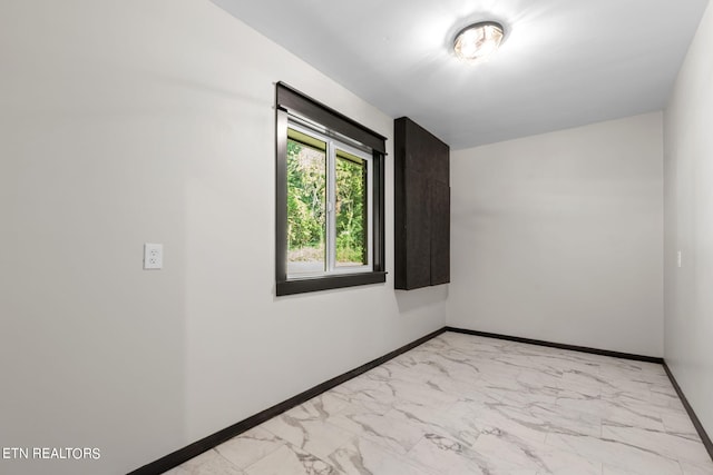 empty room featuring light tile patterned flooring