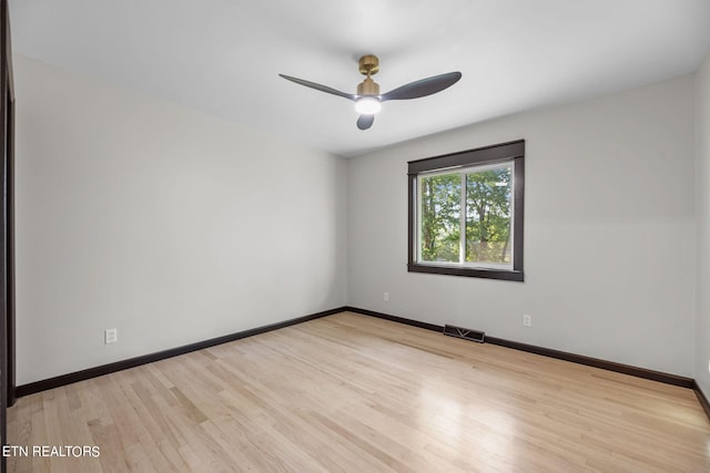 unfurnished room featuring light wood-type flooring and ceiling fan