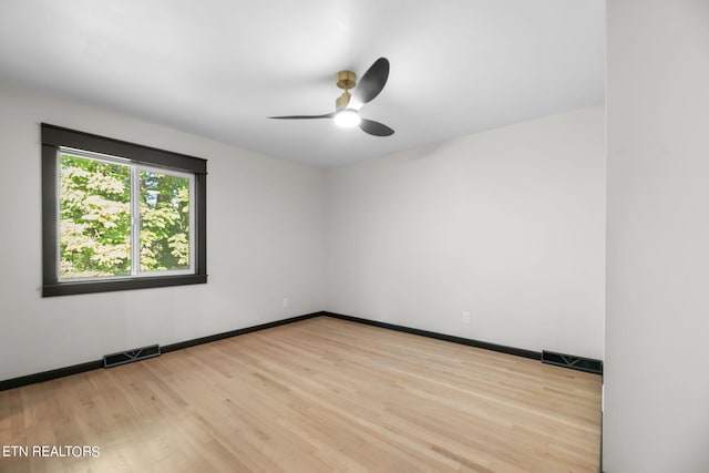 spare room with ceiling fan and light hardwood / wood-style flooring