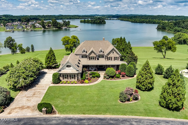 birds eye view of property with a water view