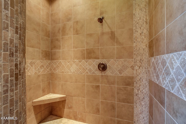 bathroom with a tile shower