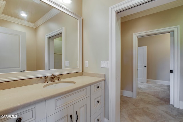 bathroom featuring tile patterned floors, vanity, and crown molding