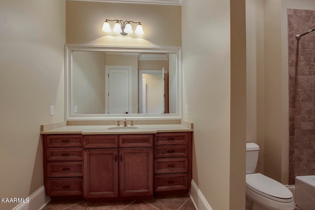 full bathroom featuring tiled shower / bath, vanity, toilet, and tile patterned floors