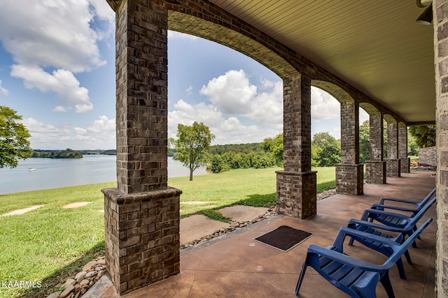 view of patio / terrace with a water view