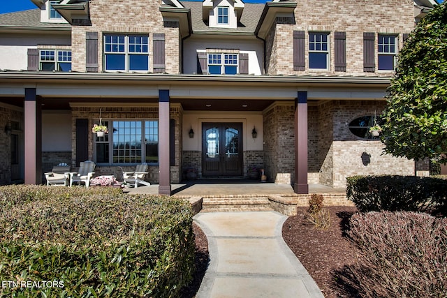 doorway to property with a porch