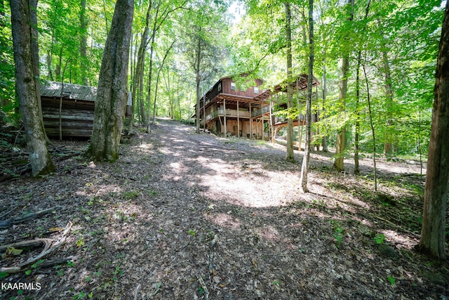 view of yard featuring a wooden deck