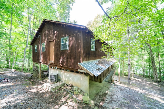 view of side of property featuring central air condition unit