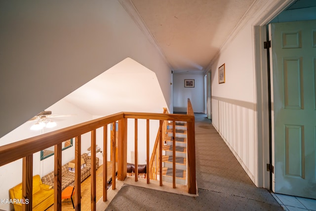 hall featuring dark carpet and ornamental molding