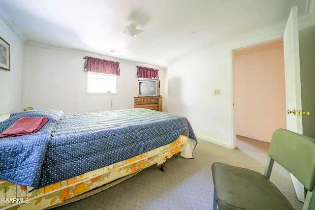 carpeted bedroom featuring crown molding