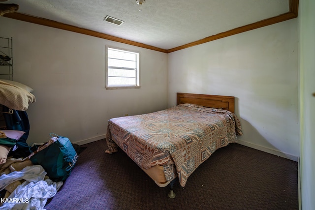 carpeted bedroom featuring a textured ceiling