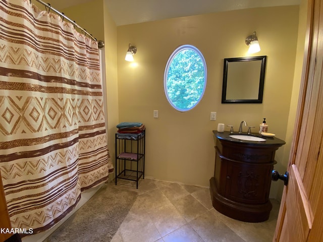 bathroom featuring vanity and a shower with shower curtain