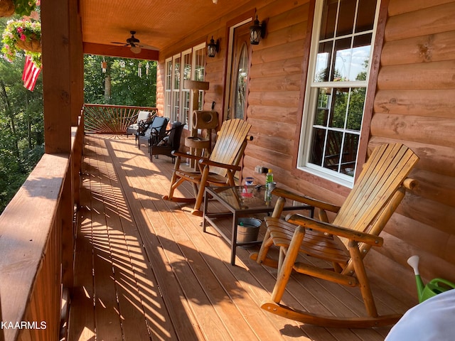 wooden deck with ceiling fan and a porch