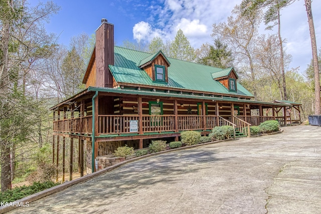 view of property exterior featuring a porch