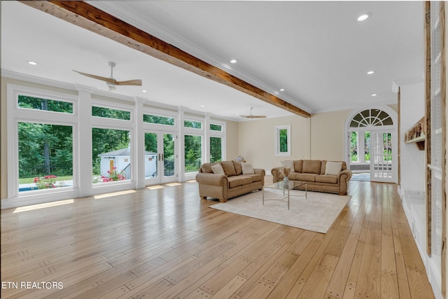 living room featuring french doors, light hardwood / wood-style flooring, ceiling fan, and crown molding