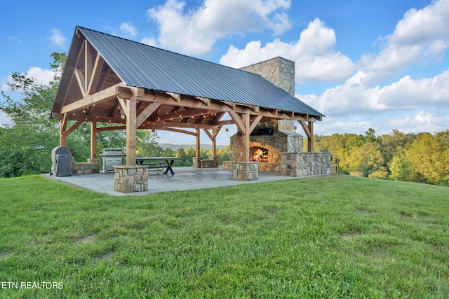 view of property's community with a gazebo, a yard, and a patio area