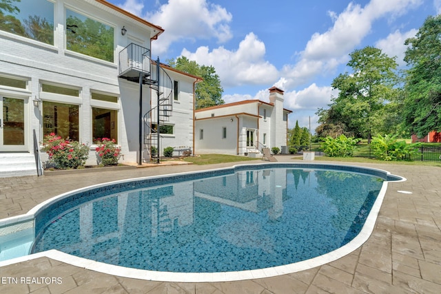 view of pool with a patio area