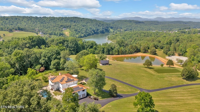 drone / aerial view with a water and mountain view