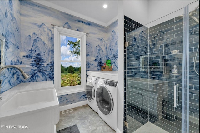 laundry area featuring sink and washer and dryer