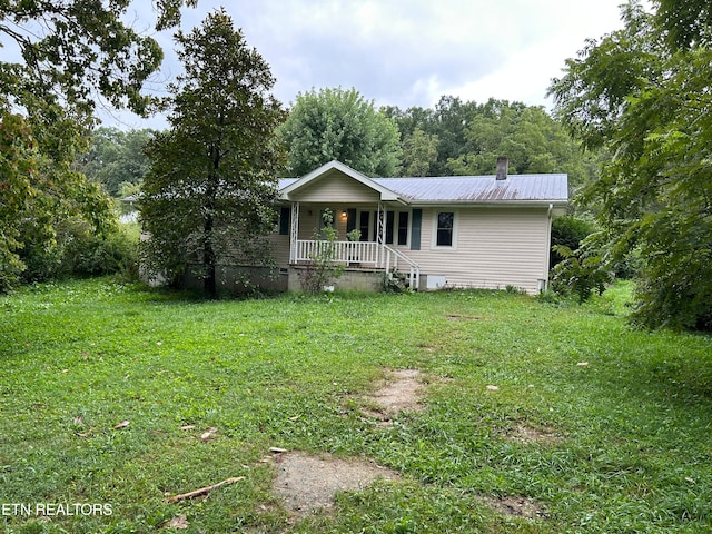 view of front facade with covered porch and a front lawn