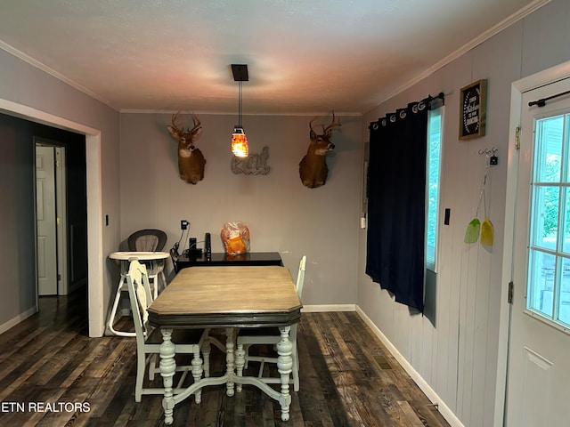 dining space with crown molding and dark hardwood / wood-style flooring