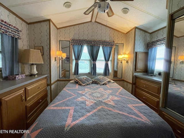 bedroom with ceiling fan, ornamental molding, and vaulted ceiling