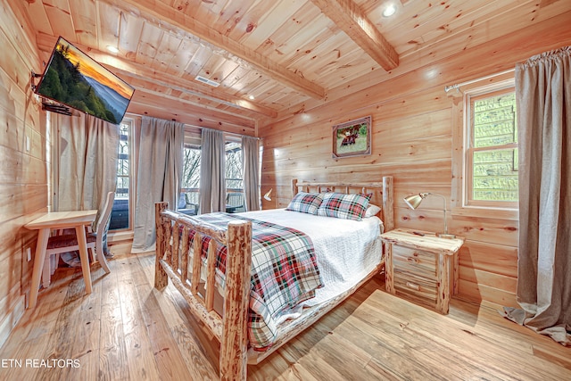 bedroom with multiple windows, light wood-type flooring, and wood ceiling