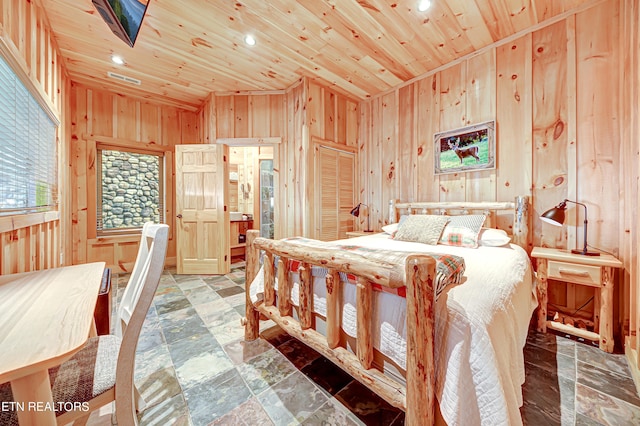 bedroom featuring wooden ceiling, wooden walls, and tile floors