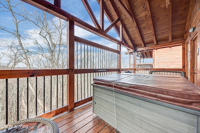 wooden terrace with a hot tub