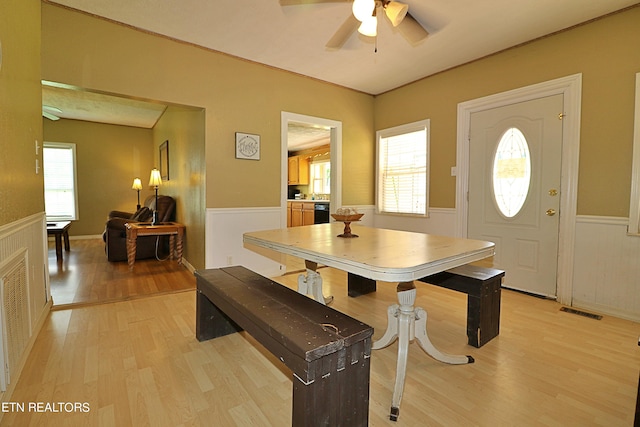 dining room with ceiling fan, a healthy amount of sunlight, and light hardwood / wood-style floors