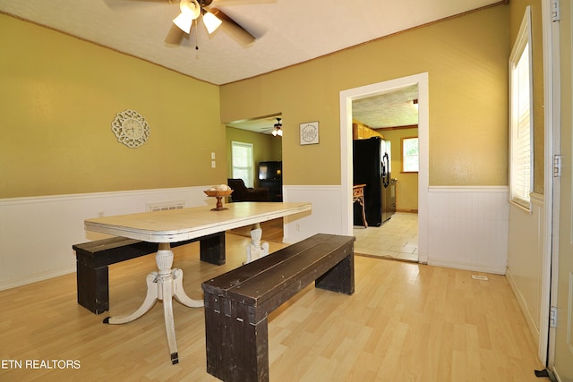 dining room with ceiling fan and light hardwood / wood-style floors