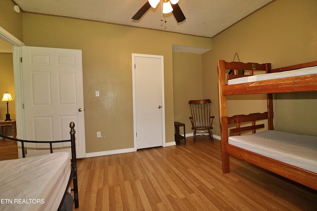 bedroom featuring ceiling fan and light hardwood / wood-style flooring