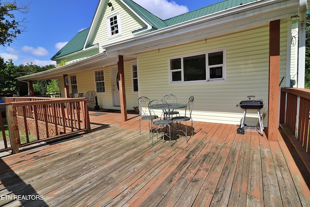 wooden terrace with area for grilling