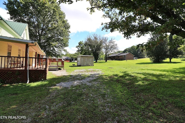 view of yard with a wooden deck